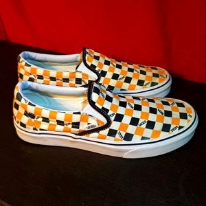 Slip on orange black checkered Vans